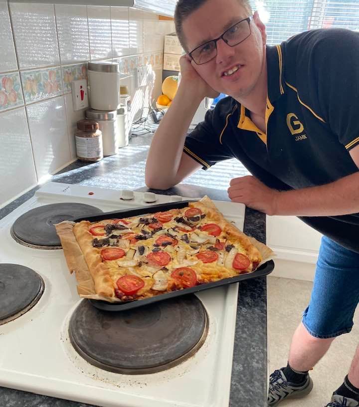 Man with pizza, supported living